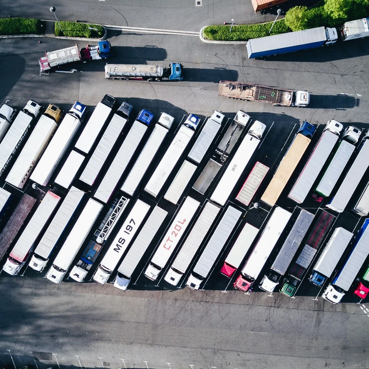 Commercial trucks organized in a fleet yard
